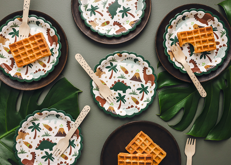 The patterned Dino Fun plates styled on a party table.